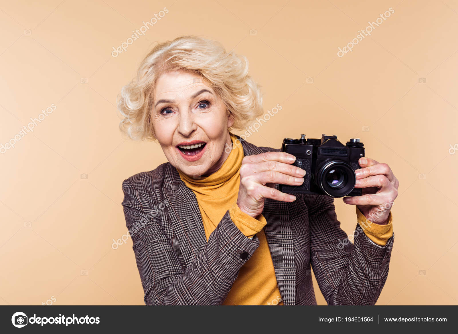 depositphotos_194601564-stock-photo-surprised-senior-woman-film-camera.jpg